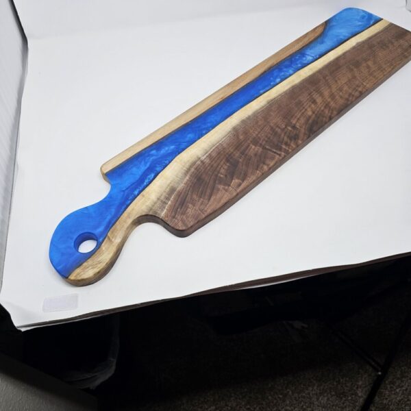 Product image of Long Narrow Walnut and Blue Resin Charcuterie Board with handle